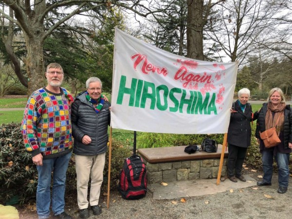 Keith with his sisters Alison and Maire and brother in law Mike, with peace banner